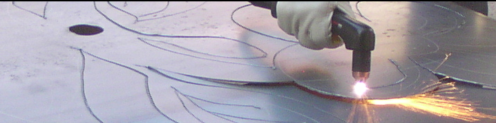 Photo of Jayne drawing on a steel sheet
